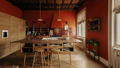 The kitchen in this historic apartment has an unexpected and utterly unique color palette – it's bold yet surprisingly timeless