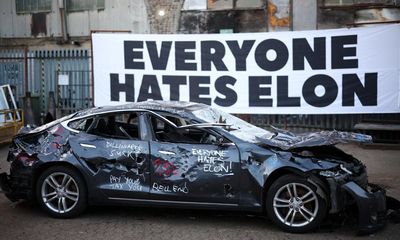 Sledgehammer-wielding Musk critics smash up Tesla in London art project