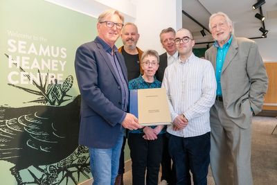 Adrian Dunbar gives rare art book to the Seamus Heaney Centre