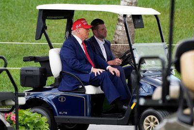 ‘Completely out of touch’: golf and dinners for ‘king’ Trump as economy melts down
