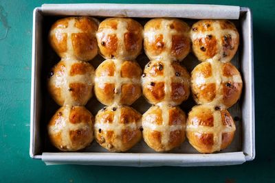 Bourbon-plumped currants enhance the flavor of hot cross buns for Easter