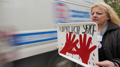 Students block entrance to Serbia's state TV accusing it of pro-government bias