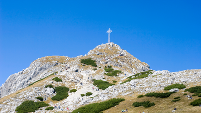 Men fined for night mountain mission to illuminate cross in national park on 20th anniversary of Pope's death