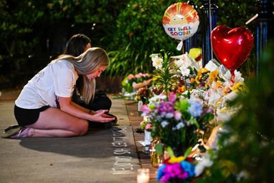 Shocked students return to Florida campus after shooting that killed two