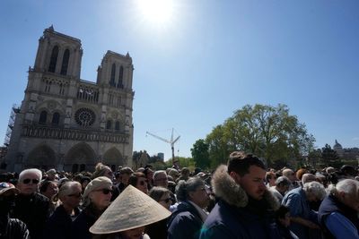 Worshippers return to restored Notre Dame for Easter rituals with emotion and awe