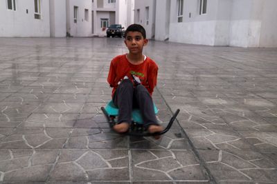 ‘How do I live like this?’ asks Gaza boy who lost arms in Israeli attack