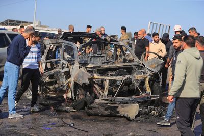 Hezbollah says it won't hand over weapons while Israeli troops remain in southern Lebanon