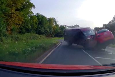 Moment wrong-way minibus driver smashes head-on into car