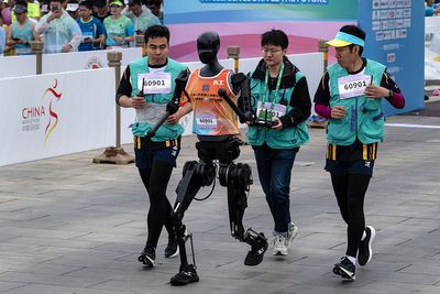 Watch humans face robot competitors for first time in half marathon