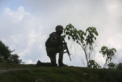 3 Haitian soldiers warring with gangs are slain outside of Port--au-Prince