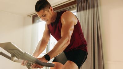 I used indoor cycling to help me run a faster marathon — here’s 6 ways it helped