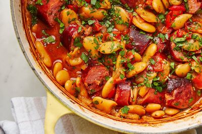 This rustic dish of baked beans and smoked sausages is packed with deep, aromatic flavors