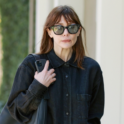 Elizabeth Olsen Wears a $1,350 Denim Shirt From The Row to Visit Her Sisters' Store