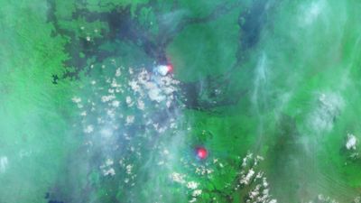 Pair of 'glowing' lava lakes spotted on Africa's most active volcanoes as they erupt simultaneously — Earth from space