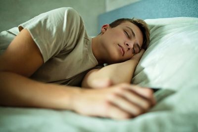 Teenagers who sleep longer and earlier are likely to do better at tests, study finds