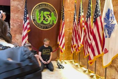 Extinction Rebellion protester defaces Trump Tower presidential plaque with bright green paint