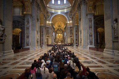 AP PHOTOS: Faithful join the line to pay their final respects to Pope Francis