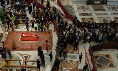 Pope Francis: thousands more pay respects on second day of lying in state