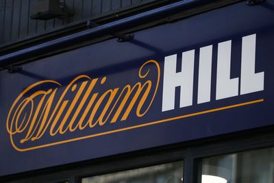 William Hill owner says UK arm impacted by tighter gambling restrictions