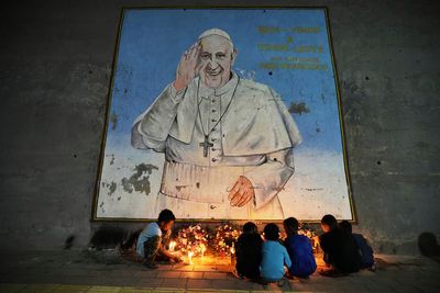 AP PHOTOS: Pope Francis' image is everywhere as the Catholic faithful mourn him with art and thanks