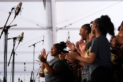 Student gospel singers take stage at New Orleans festival known for celebrity acts