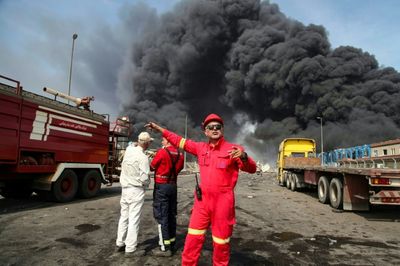 Eighteen Killed, Fires Still Burning In Huge Iran Port Blast