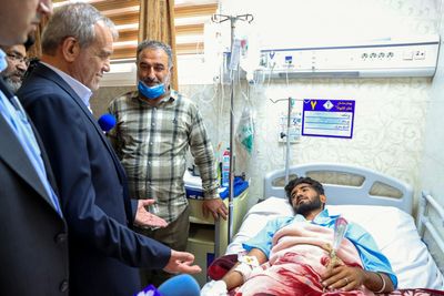 Iran’s President Pezeshkian visits injured, site of deadly port explosion