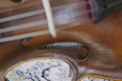 A secret note hidden in Dachau-built ‘Violin of Hope’ tells a tale of survival and craftsmanship