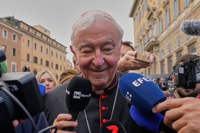 Journalists swarm cardinals at the Vatican gates as they meet to plan a conclave