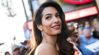 Amal Clooney rarely dresses down in denim - but her boyfriend jeans were ideal dinner date attire