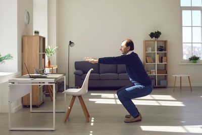 How doing squats between emails could boost your health in midlife