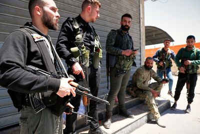 Clashes between Druze gunmen and pro-government fighters in Syrian capital kill at least 10
