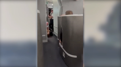 WATCH: Elderly Woman Tries to Storm Cockpit Before Being Slammed to the Ground by American Airlines Staff