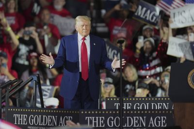 Trump marks tumultuous first 100 days in office with rally in Michigan