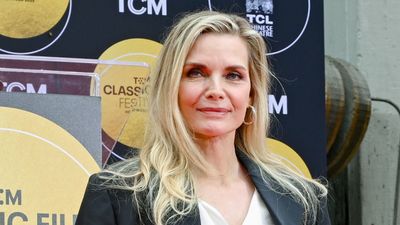 Michelle Pfeiffer's sapphire blue swimsuit and crystal-encrusted shades take poolside glamour to a whole new level