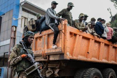 Red Cross escorts hundreds of stranded Congolese soldiers from rebel-controlled city to capital