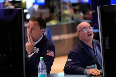 AP PHOTOS: US stocks sink after a weak report on the economy