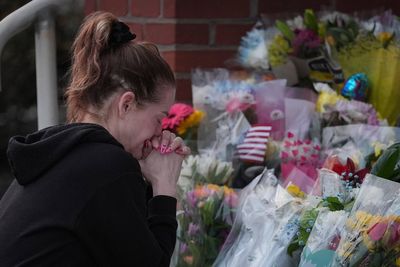Prosecutor says officer killed in gunman's Pennsylvania hospital attack was hit by fire from police