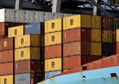Bank Of Japan Holds Rates, Lowers Growth Forecasts