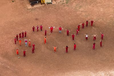 Inmates awaiting deportation make giant ‘SOS’ message with their bodies that can be seen from the skies