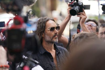 Russell Brand arrives at a London court to face rape and sexual assault charges