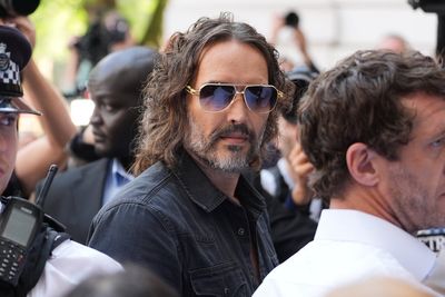 Russell Brand swarmed by photographers as he arrives at court to face rape and sexual assault charges