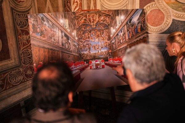Vatican workers install Sistine Chapel stove where ballots are burned during conclave to elect pope