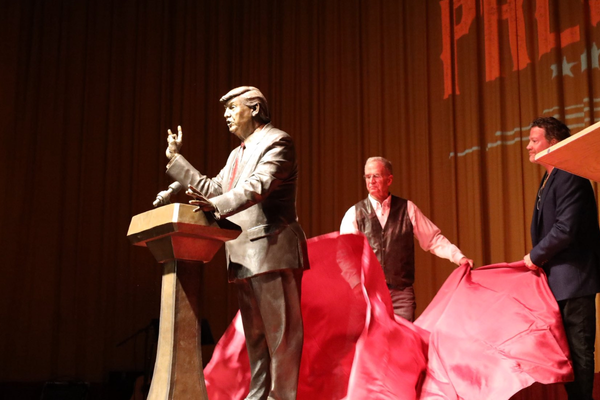 Trump statue unveiled in South Dakota city to half-filled auditorium as protesters gathered outside