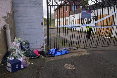 Tribute paid to boy who died in fire as 14 children arrested