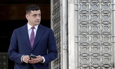 Far-right Trump ally secures decisive win in first round of Romania’s presidential election rerun