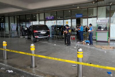 SUV removed from scene after crashing through Manila Airport entrance killing girl, 4