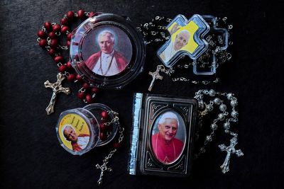 AP PHOTOS: Holy tchotchkes: Rome is awash with papal souvenirs