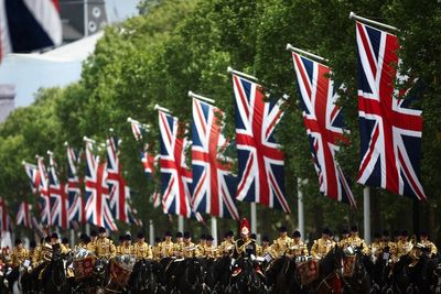Thousands of people gather near Buckingham Palace to mark the 80th anniversary of V-E Day