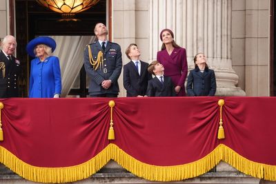 Royals wave as thousands gather to watch VE Day flypast over Buckingham Palace